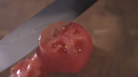 Cut a tomato with a sharp knife. Close up. Stock Footage 143171666