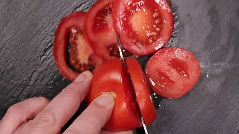 Cut a tomato into slices - top down view 動画素材 151059025
