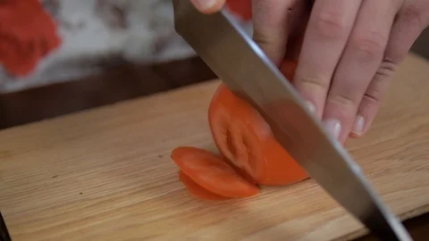 Cut tomatoes with a knife Stock Footage 93385488