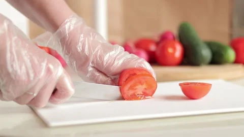 Cut tomatoes on a plastic cutting board Stock Footage 241585343