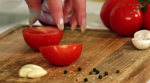 Cut the tomatoes for the salad Stock Footage 64554454