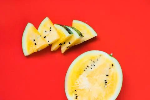 Cut off triangular slices of ripe yellow watermelon on white background 写真素材