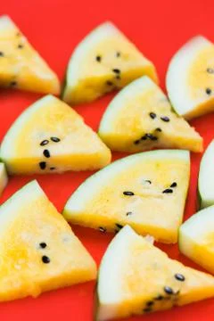 Cut off triangular slices of ripe yellow watermelon on white background 写真素材