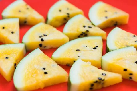 Cut off triangular slices of ripe yellow watermelon on white background 写真素材