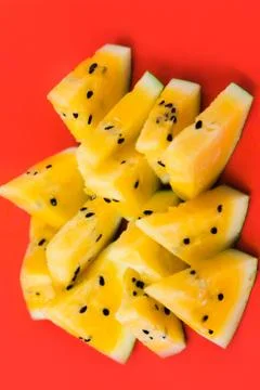 Cut off triangular slices of ripe yellow watermelon on white background 写真素材