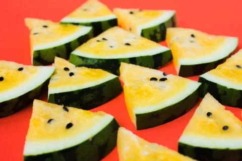 Cut off triangular slices of ripe yellow watermelon on white background 写真素材