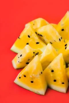 Cut off triangular slices of ripe yellow watermelon on white background 스톡 사진