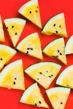 Cut off triangular slices of ripe yellow watermelon on white background 스톡 사진