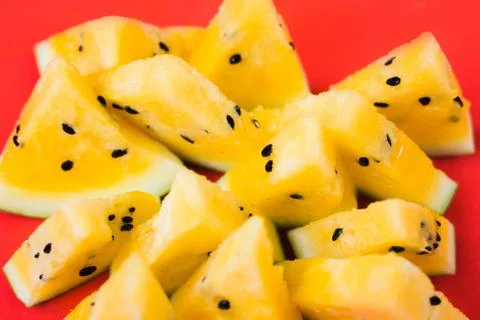 Cut off triangular slices of ripe yellow watermelon on white background 写真素材