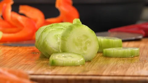 Cut vegetable and a knife on a kitchen counter  - closeup 스톡 동영상 90434287