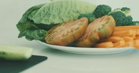 Cut vegetables on a plate Video stock 101030599