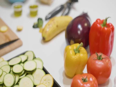 Cut up vegetables on a table Stock Footage 80545556