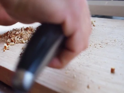 Cut walnut with knife Stock Footage 81970223