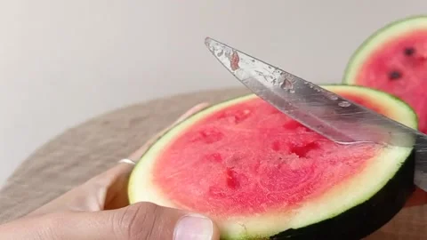 Cut up a watermelon into two pieces Stock Footage 145659552