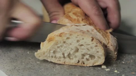 Cut white bread. Slicing bread on a cutting board. Stock Footage 197977534
