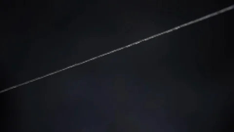 Cut the white thread with scissors Stock Footage 108499835