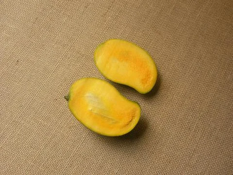 Cut yellow color ripe fresh Neelam mango Stock Photos