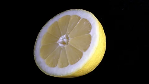 Cut Yellow Lemon - Macro Close up View on a Black Background Stock-Footage 90219984