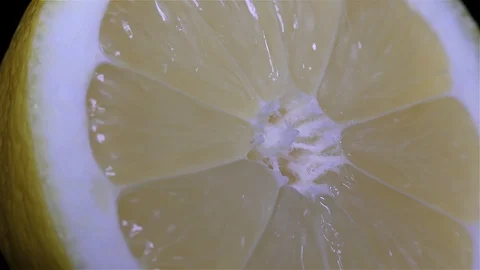 Cut Yellow Lemon - Macro Close up View on a Black Background Stock Footage 90220028