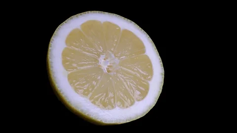 Cut Yellow Lemon - Macro Close up View on a Black Background Stock Footage 90220039
