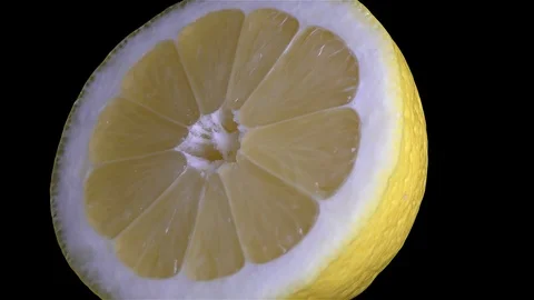 Cut Yellow Lemon - Macro Close up View on a Black Background Stock Footage 90220044