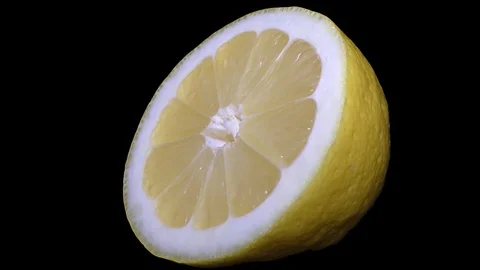 Cut Yellow Lemon - Macro Close up View on a Black Background Stock Footage 90220108