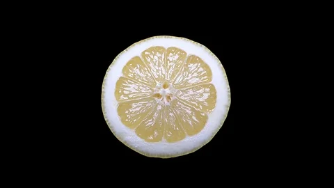 Cut Yellow Lemon - Macro Close up View on a Black Background Stock Footage 90220157