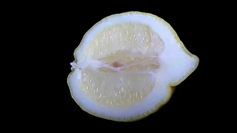 Cut Yellow Lemon - Macro Close up View on a Black Background Stock Footage 90220171