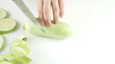Cut the zucchini on the kitchen table.Pieces round shape. Stock-Footage 136450442