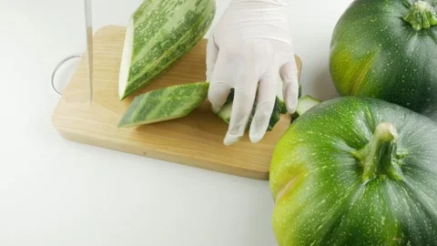 Cut the zucchini with a sharp knife. Stock Footage 137317775