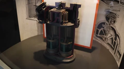 Cutaway model of an old industrial machine shows internal pistons and components Stock Footage 304884618