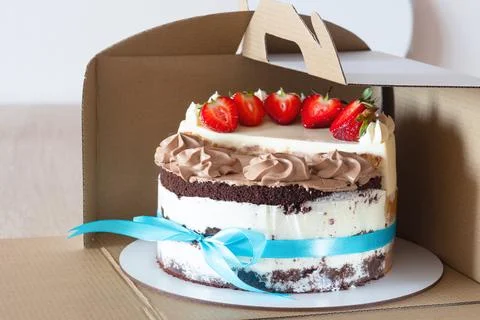 Cutaway view of assorted mini cakes in eco-friendly packaging. Photos