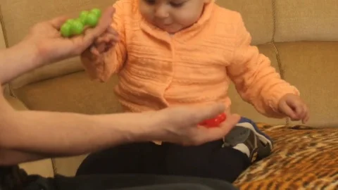 Cute active 9-10 months old baby boy making choice Stock Footage 82898277