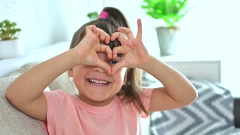 Cute adorable small kid make heart shape hand gesture. Stock Footage 177877544