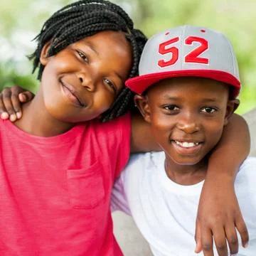 Cute african boy and girl outdoors. Stock Photos