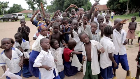 Cute African school children posing for the camera in Rural Nigeria Stock Footage 165983451