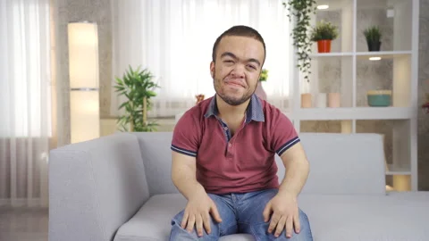 Cute and cheerful young dwarf man looking at camera giving motivation Stock Footage 230966483