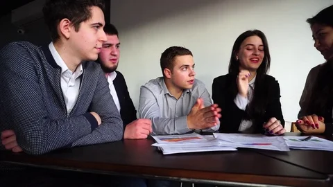 Cute and educated young men and women are engaged in developing algorithms and Stock Footage 78480544