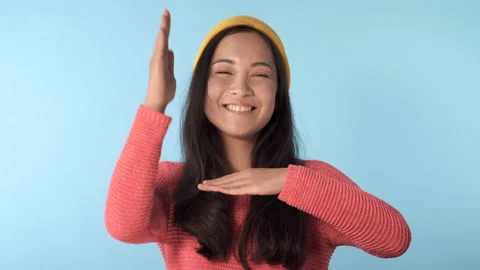 Cute and funny looking young asian model dancing.  Video stock 125330041