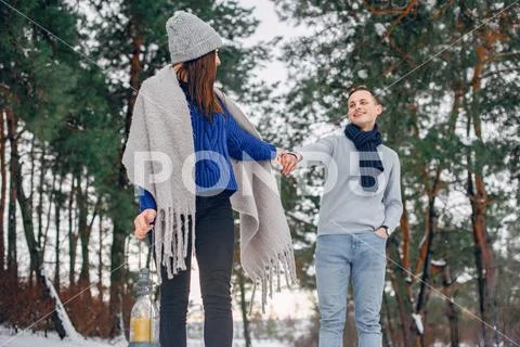 Cute and loving couple in a winter forest Stock Photos