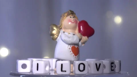 Cute angel and a declaration of love. Valentine's Day. Postcard for the holidays Stock Footage 146336520