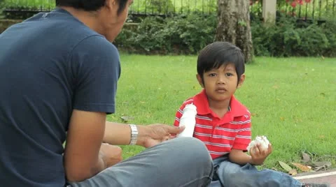 Cute Asian Boy Drinking Milk At The Park Stock-Footage 10866157