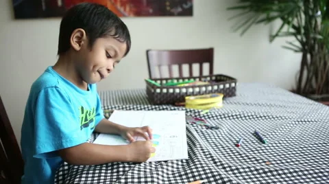 Cute Asian Boy Spends Time Colouring Pictures 스톡 동영상 40729139