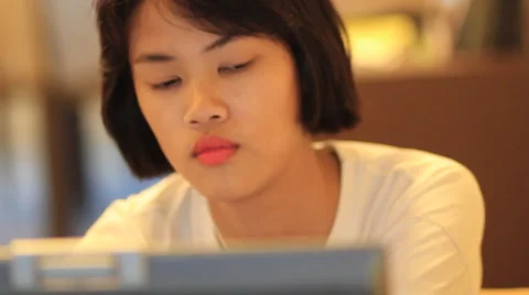 Cute Asian teen using smart phone with handheld camera Vidéo 63757267