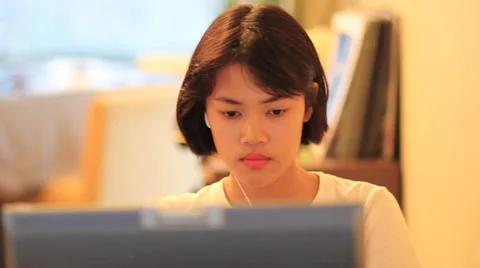 Cute Asian teen using smart phone with handheld camera Vidéo 63757424