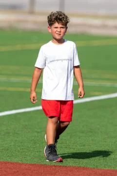 Cute athletic boy playing flag football Stock Photos