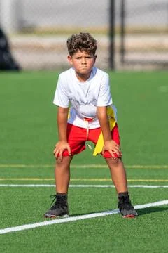 Cute athletic boy playing flag football Stock Photos