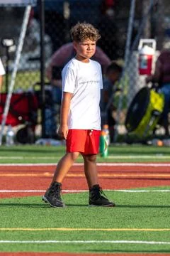 Cute athletic boy playing flag football Stock Photos
