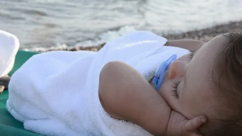Cute babe sunbathing on the beach lying on a  near the sea Video stock 96774058
