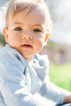 Cute baby in a blue sweater with hearts. Portrait. Close-up Stock Photos